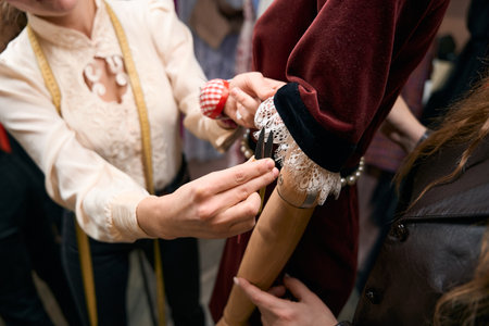 Dressmaker holds small scissors in her handsの写真素材