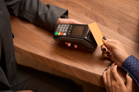 Female paying for service with credit card