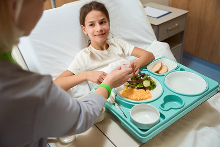 Doctor giving medicine to patient while eatingの写真素材