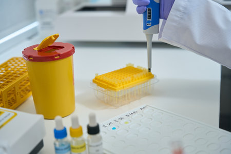 Laboratory assistant in a chemical laboratory conducts blood type testの写真素材