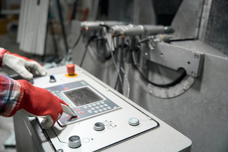 Male controlling information on electronic machine in the workshop