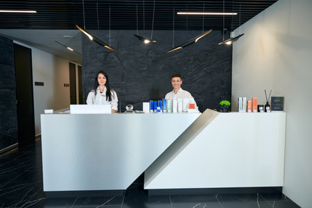 Woman and man standing in the officeの写真素材