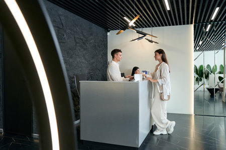 Client paying for services in beauty salonの写真素材