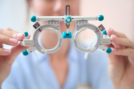 Detail photo of ophthalmology trial frame in front of the doctorの写真素材