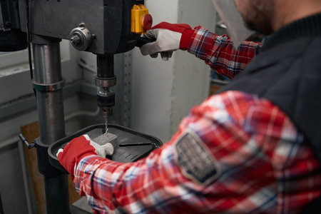 Adult man working with equipment in the factoryの写真素材
