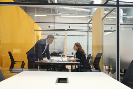 Man and woman discussing cooperation in the business centerの写真素材