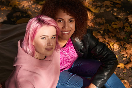 Interracial lesbian couple spending time together outdoors