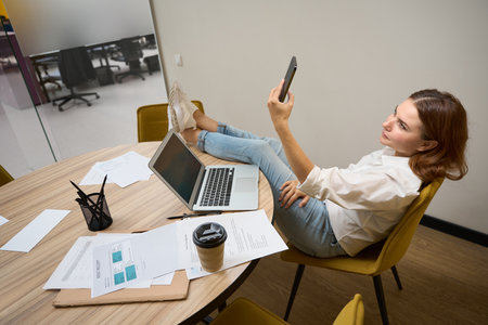 Woman having video call on the phoneの写真素材