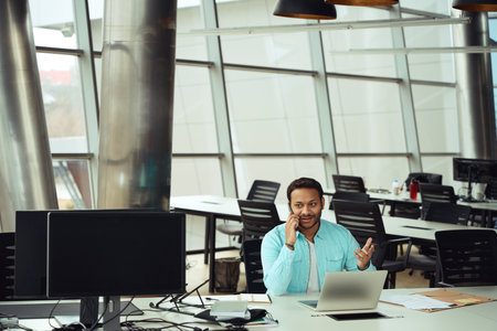 Male talking on smartphone in the office