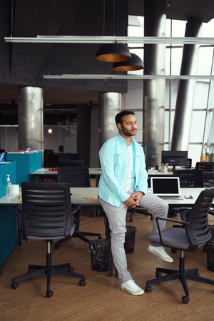 Man waiting for colleagues at work in the officeの写真素材