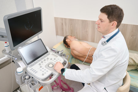 Cardiologist making scanning of internal organs in the hospitalの写真素材