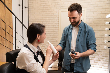 Master demonstrates jars of care products to a young woman
