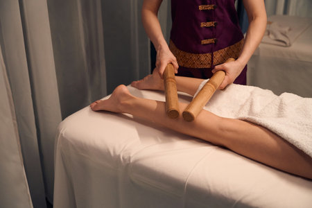 Qualified spa therapist giving patient relaxing Creole massageの写真素材