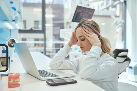 Woman tired from working in the hospitalの写真素材