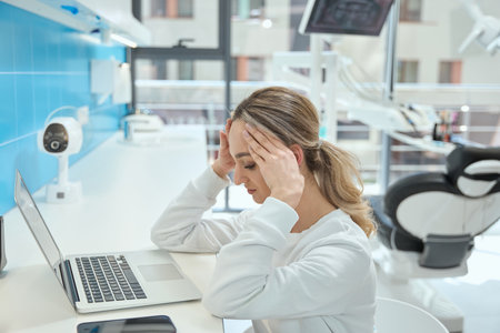 Female tired from working in the stomatologyの写真素材