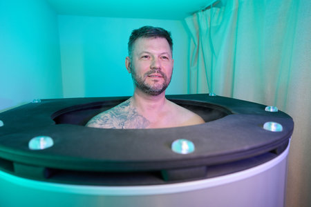 Spa client is undergoing whole body cryotherapy sessionの写真素材