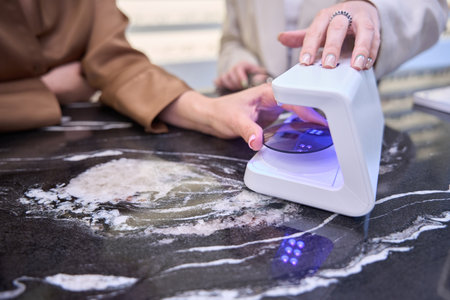 Lady is having a consultation in a modern optics salonの写真素材