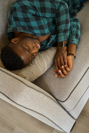 Man fell asleep sweetly on a cozy sofaの写真素材