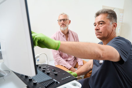 Doctor consults an elderly patient in an ultrasound room