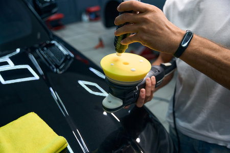 Detailing a black car in a car repair shopの写真素材