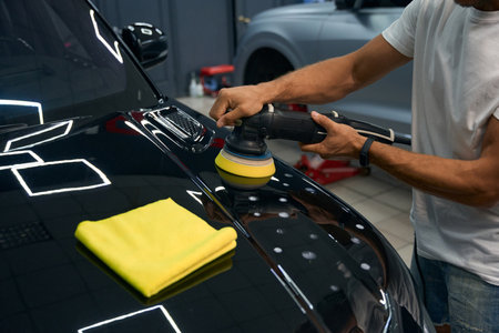 Detailing a car in a car repair shopの写真素材
