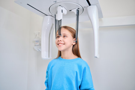 Girl is fixed for a dental x-ray