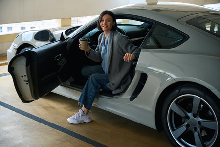 Beautiful female entering or exiting of car