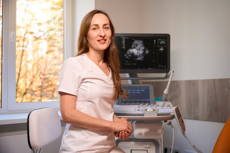 Professional female obstetricians sitting on working placeの写真素材