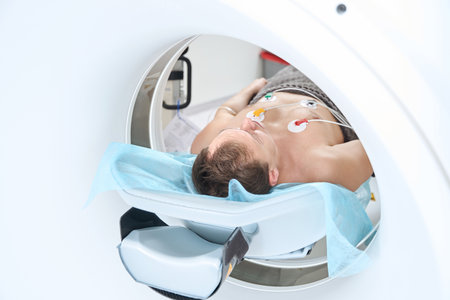Patient is undergoing contrast-enhanced ECG-gated coronary CT angiographyの写真素材
