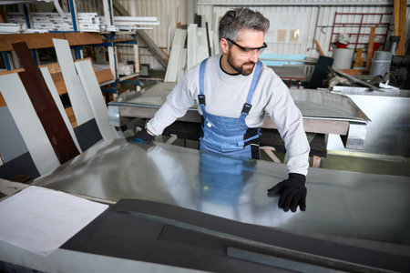 Man works in a modern production facility