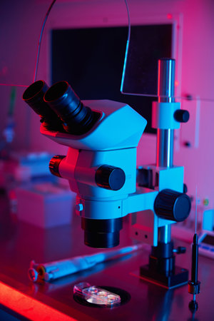 Lab tools arranged under vivid colored lighting