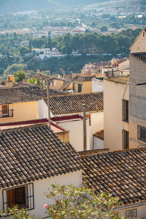 View of tile roofs of buildings in old town Polop, Spainの写真素材