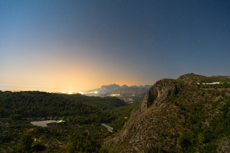 Serene night landscape with mountains and starry sky in Costa Blancaの写真素材