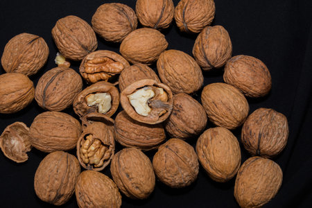 Walnuts on a black background, close-up, studio shot