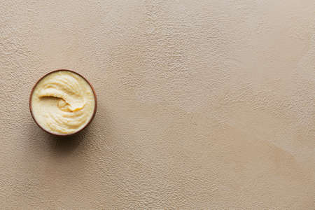 Background with a bowl of chickpeas homemade hummusの写真素材