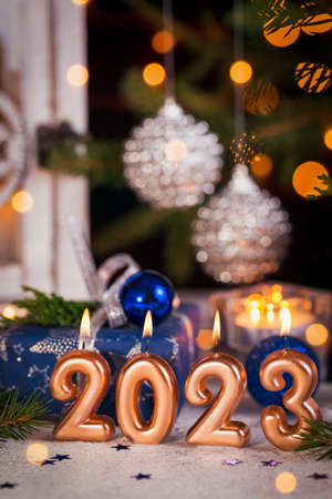 Abstract Advent 2023 Background. Christmas card with holiday mood. Christmas Lantern With Fir Branch and Decoration with gifts And Defocused Lightsの写真素材