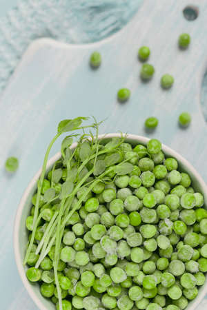 Green organic peas and sprout in a bowl. Concept of homemade preparations for fast cooking. Healthy vegetarian food conceptの写真素材