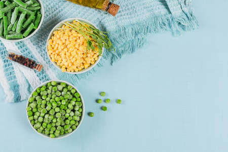 Green peas, sweet corn, cut green beans in bowlの写真素材