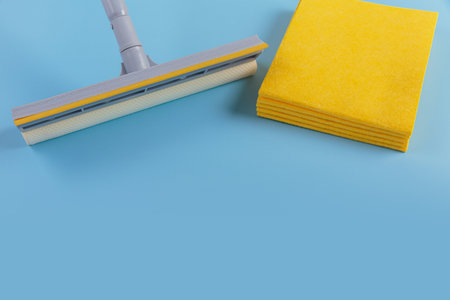 Set for cleaning windows on blue background