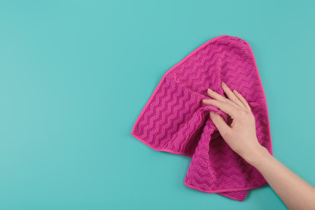 Womans hand holding rag. Set for cleaning windows