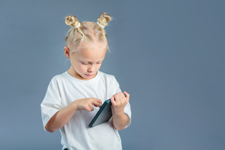 Cute girl holding calculator and learning to countの写真素材