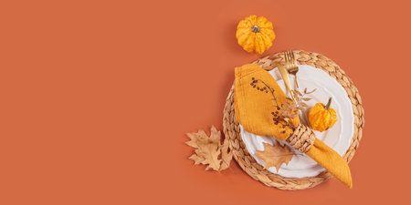 Autumn table setting with pumpkin decorationsの写真素材