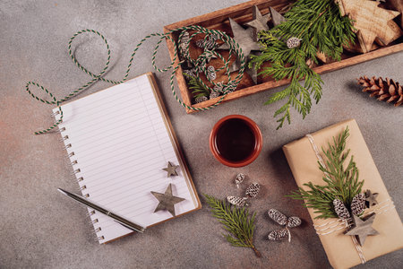 Notebook with pen, handmade gift box and Christmas wooden decorの写真素材