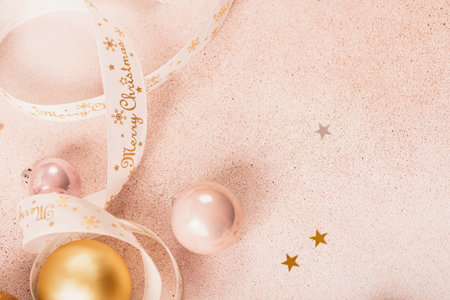 Festive Christmas and New Year background with gold and pink baubles and ribbonsの写真素材