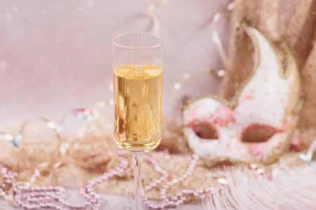 Masquerade ball holiday background with sparkling wineの写真素材