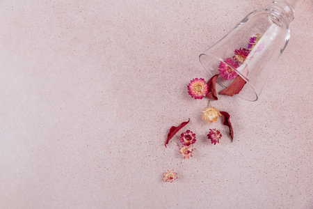 Autumn composition from glass full of red dried flowers and leavesの写真素材