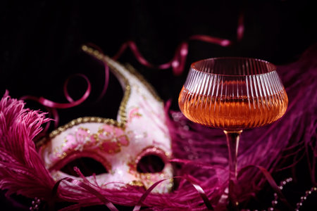 Masquerade ball holiday background with sparkling wineの写真素材