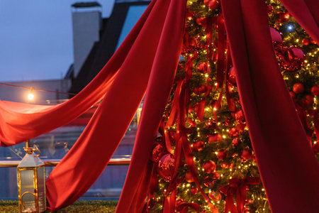 Christmas tree with rich red decor and lightsの写真素材
