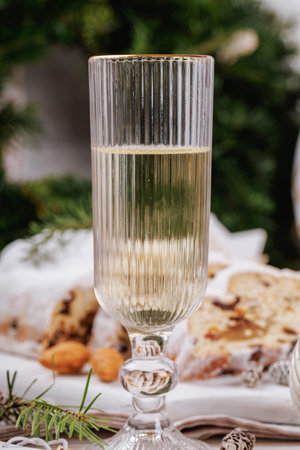 Holiday champagne toast with festive table decorの写真素材