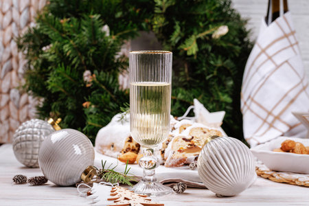 Christmas table setup with sparkling champagne glassの写真素材